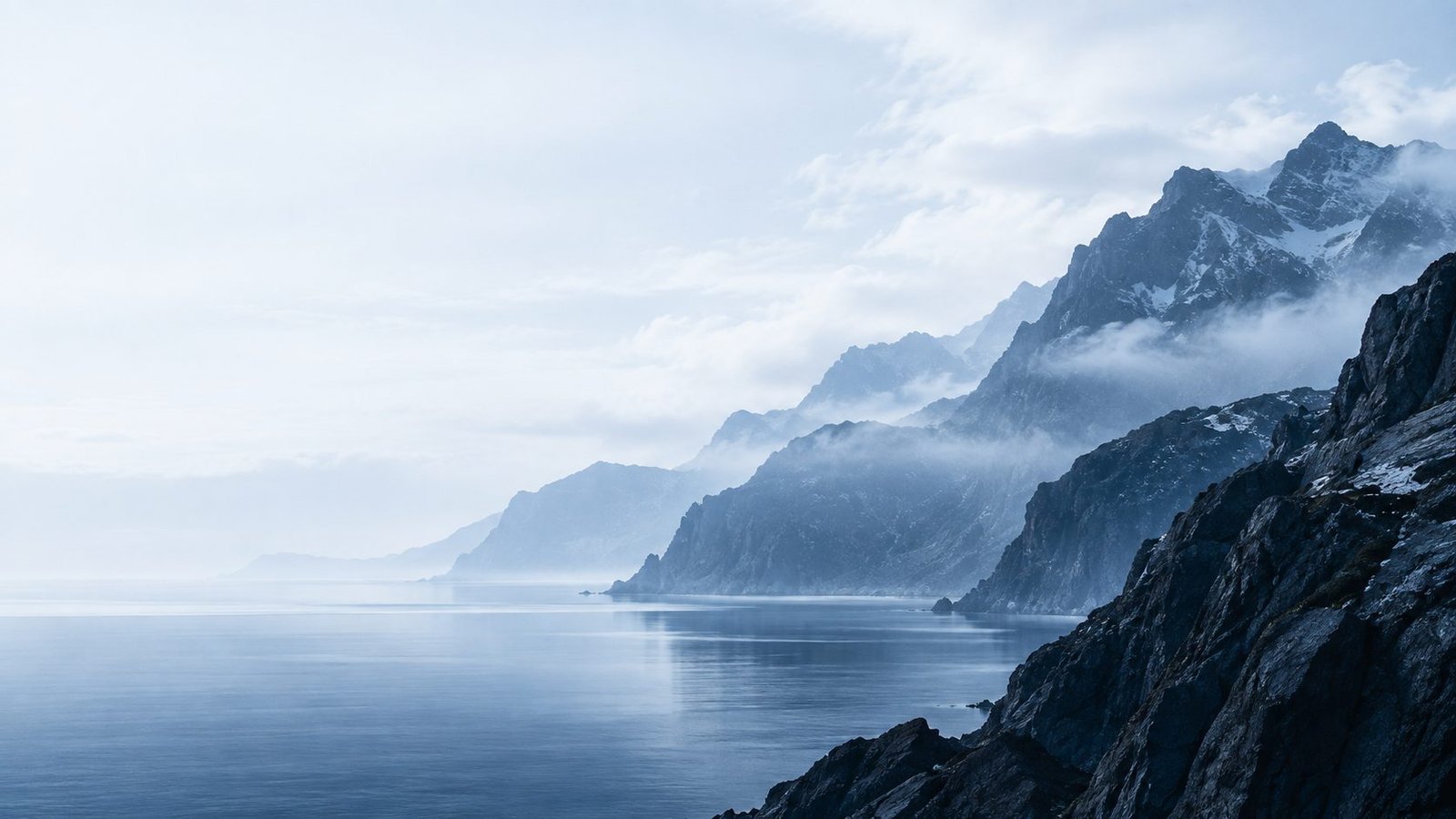 Misty mountain and cliff landscape representing the visible security surface